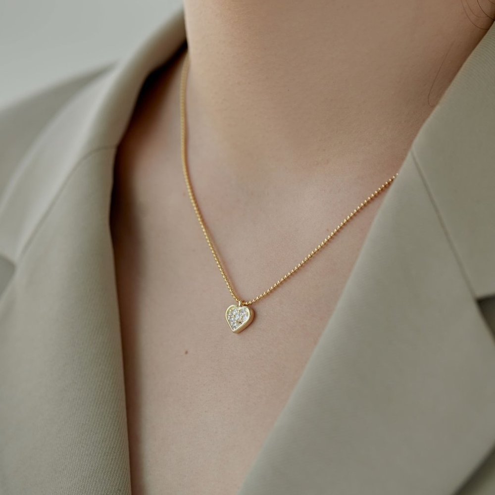Glistening Gold Heart Pendant Necklace in Sterling Silver